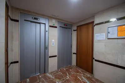 a hallway with two elevators in a building at Apartamento El Pentagrama de Cádiz in Cádiz