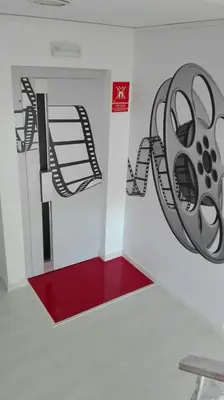 a room with a wall with a wheel on the wall at Hotel Sur Utopia in El Puerto de Santa María