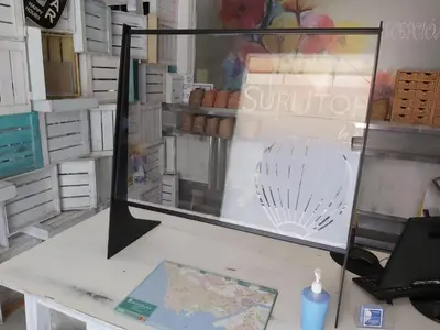 a display case in a store with a map on a table at Hotel Sur Utopia in El Puerto de Santa María
