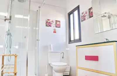 a bathroom with a shower and a toilet at Bungalow Ramos II in Conil de la Frontera