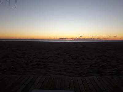 a sunset on the beach with the horizon at Hostal Centro Sol in Cádiz