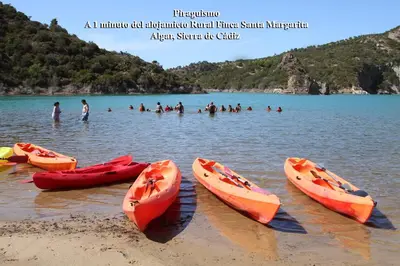 a group of kayaks on the beach at a lake at Alojamiento Rural - Finca Santa Margarita in Algar