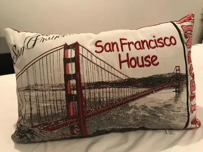 a pillow with a picture of the san francisco house at San Francisco's House in Medina Sidonia