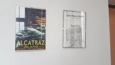two posters are hanging on a wall at San Francisco's House in Medina Sidonia