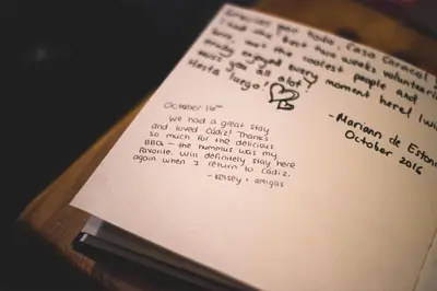 a book with a note on top of it at Casa Caracol in Cádiz