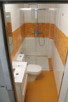 a bathroom with a shower and a toilet and a sink at Kiana Mirador Puerto Sherry con parking in El Puerto de Santa María