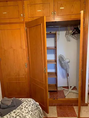 a bunk bed with a closet and a fan at Traumhaus für 6 Personen mit spektakulärem privaten Pool und schönem Ausblick in die Natur in Hozanejos