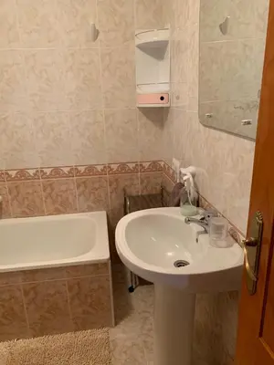 a bathroom with a sink and a bath tub at Traumhaus für 6 Personen mit spektakulärem privaten Pool und schönem Ausblick in die Natur in Hozanejos