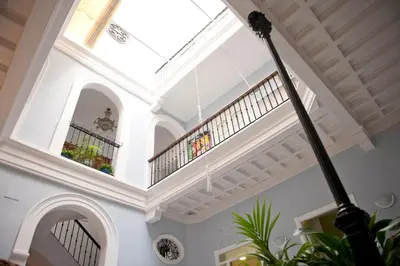 a large room with a ceiling with a skylight at Casa Patio del Panadero in Cádiz