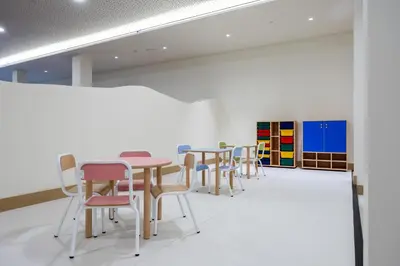 a group of tables and chairs in a room at Hipotels Barrosa Garden in Chiclana de la Frontera