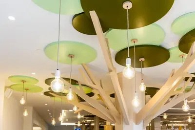 a room with green and white ceilings and lights at Hipotels Barrosa Garden in Chiclana de la Frontera
