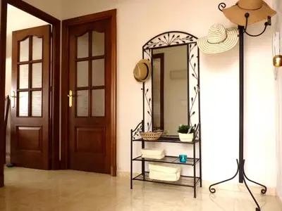 a mirror on a wall next to a door at Playa de la Calzada in Sanlúcar de Barrameda