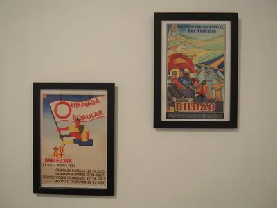 two framed posters hanging on a wall at Casa Valientes A - Parking privado gratis & patio interior in Jerez de la Frontera