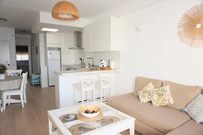 a living room with a couch and a table at Villa Horacia in Sanlúcar de Barrameda