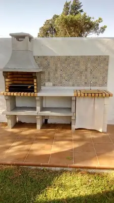 a pizza oven sitting on top of a patio at El Vivero in Chiclana de la Frontera