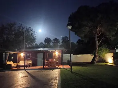 a tiny house at night with a street light at El Vivero in Chiclana de la Frontera