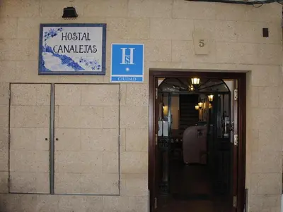 an entrance to a hospital with a sign on the wall at Hostal Canalejas in Cádiz