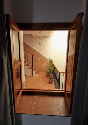 a view of a staircase from a room with a window at Hostal Canalejas in Cádiz