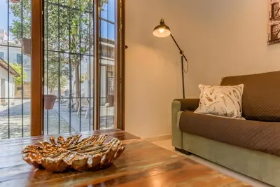 a living room with a couch and a table at Casa en Plaza de la Merced_Centro Flamenco_Cádiz in Cádiz