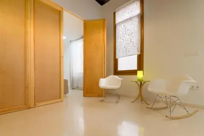 a room with two chairs and a table and a window at Casa en Plaza de la Merced_Centro Flamenco_Cádiz in Cádiz
