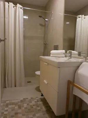 a bathroom with a sink and a shower and a toilet at Casa en Plaza de la Merced_Centro Flamenco_Cádiz in Cádiz