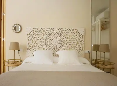 a bedroom with a white bed with two lamps at Casa en Plaza de la Merced_Centro Flamenco_Cádiz in Cádiz