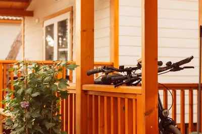 a bike parked on the porch of a house at TAIGA Puerto Santa María in El Puerto de Santa María