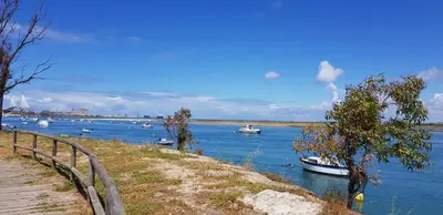 a group of boats floating on a river at Casa del Mar in Puerto Real