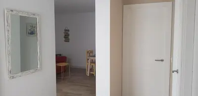 a white door with a mirror in a room at Casa del Mar in Puerto Real