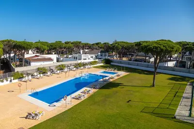 an overhead view of a swimming pool and a beach at Complejo Al Sur - by Grupo Tribu in Chiclana de la Frontera