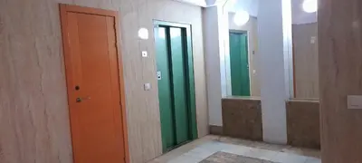a hallway with two mirrors and a brown and green door at Estudio Carmen in Cádiz