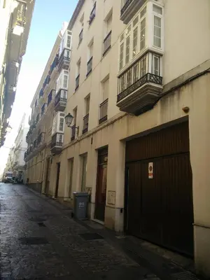 an empty street in a city with buildings at Apartamento El Patio de Canovas in Cádiz