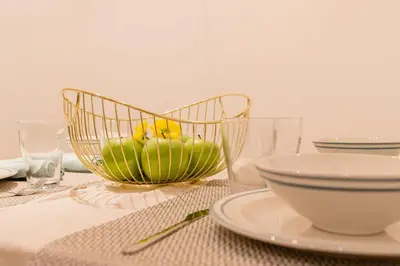 a bowl with a flower in it sitting on a table at Apartamento El Patio de Canovas in Cádiz