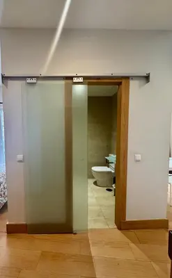 an open door to a bathroom with a toilet at Alcazar Suites in Jerez de la Frontera