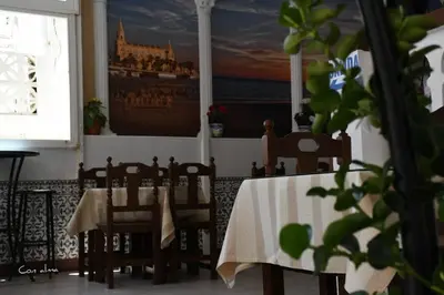 a living room with a view of the ocean at Hostal Costa de la Luz in Chipiona