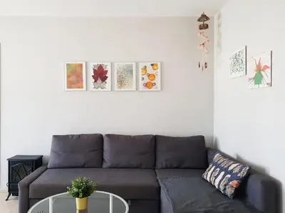 a living room with a couch and a table at Valdelagrana Mar Ha Apartment in El Puerto de Santa María