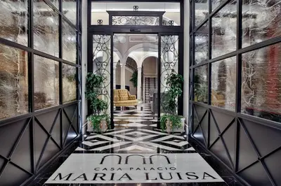 a lobby of a maria huglia building with a doorway at Hotel Casa Palacio María Luisa in Jerez de la Frontera