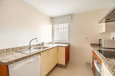a kitchen with a sink and a counter top at Modern design apartament in Conil! in Conil de la Frontera
