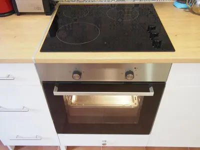 a stove top oven sitting inside of a kitchen at Casa Valientes B - Parking privado gratis & patio interior in Jerez de la Frontera