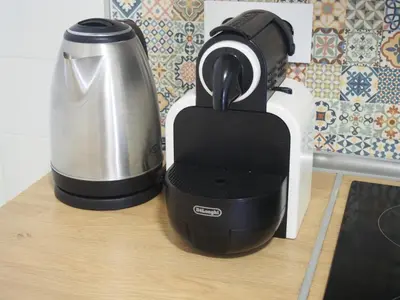 a black and white blender sitting on a counter at Casa Valientes B - Parking privado gratis & patio interior in Jerez de la Frontera