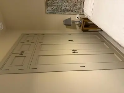 a room with a white floor with a bed at Casa Palacio de Cadiz in Cádiz