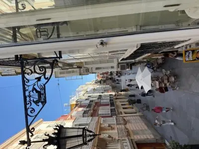 a building with a long table with many items on it at Casa Palacio de Cadiz in Cádiz