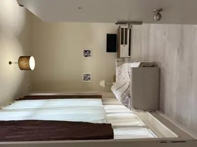 a room with a bed and a lamp in it at Casa Palacio de Cadiz in Cádiz