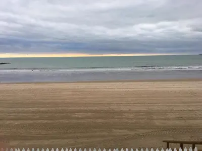 an empty beach with the ocean in the background at Panther Home Manantial in El Puerto de Santa María