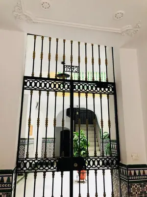 a black iron gate with a window at Apartamento San Francisco in Cádiz