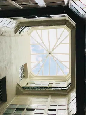 a large glass window in a building at Apartamento San Francisco in Cádiz