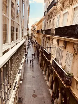 a view from a balcony of a street with buildings at Apartamento San Francisco in Cádiz