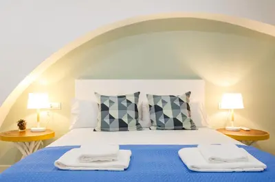 a bedroom with a bed with two towels on it at Nueva ALMUDENA Apartment by Cadiz4Rentals in Cádiz