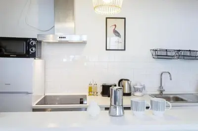 a kitchen with a sink and a counter top at Tierra & Mar Ascensor Grupo AC Gestion in Cádiz