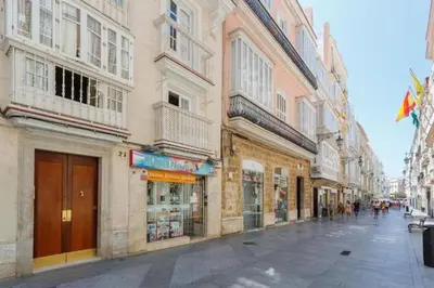 a city street with buildings and shops on a street at Tierra & Mar Ascensor Grupo AC Gestion in Cádiz